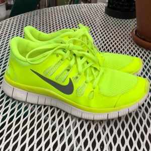 Neon yellow Nike free 5.0